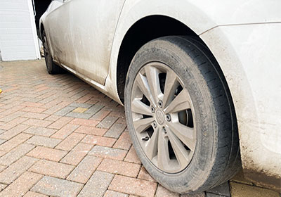 A Dirty VW Passat before a mobile valeting service in Stoke-on-Trent - wheel