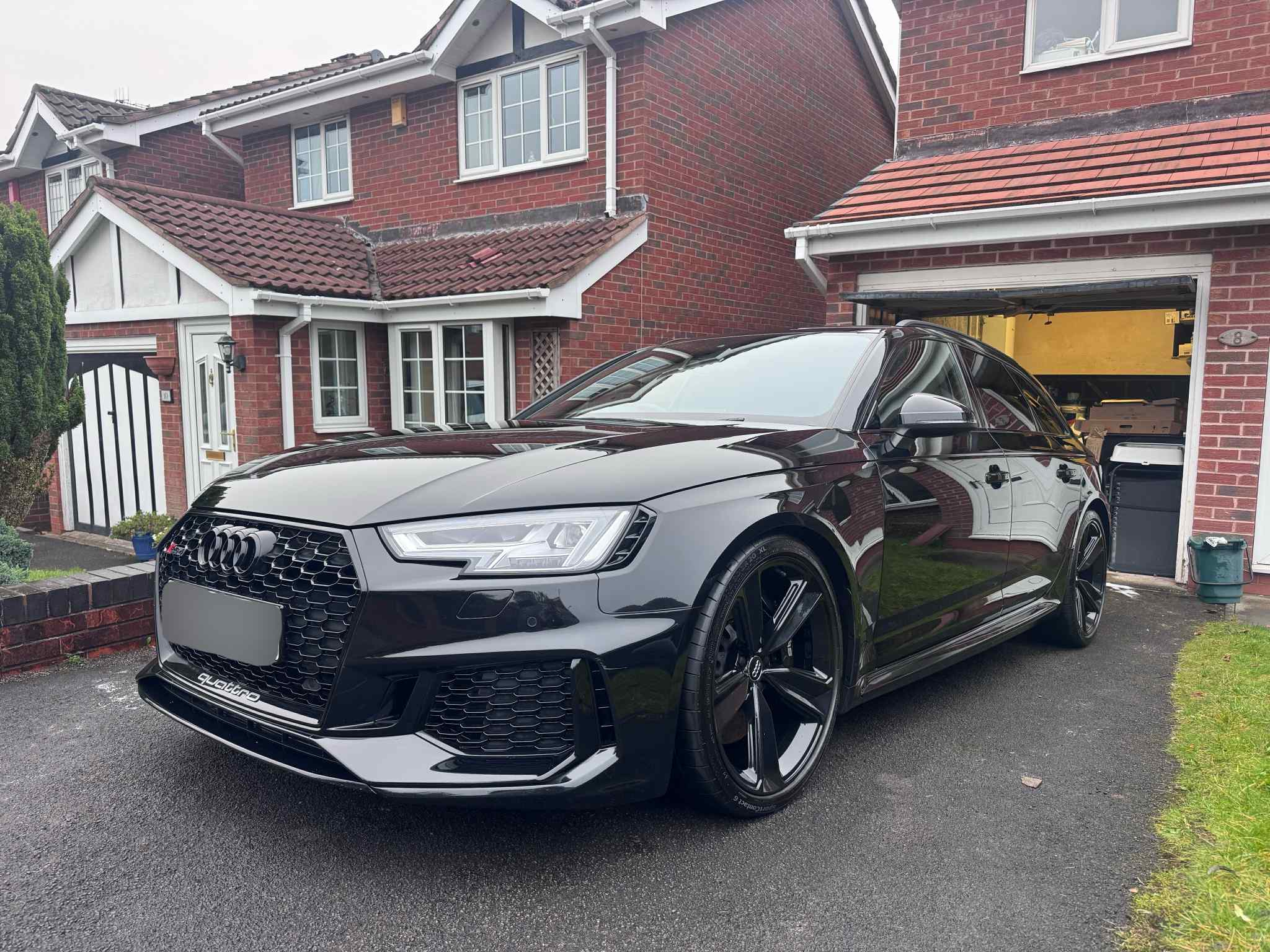 A Dirty VW Passet before a mobile valeting service in Stoke-on-Trent - front view